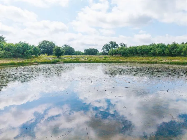 a view of a lake with a yard