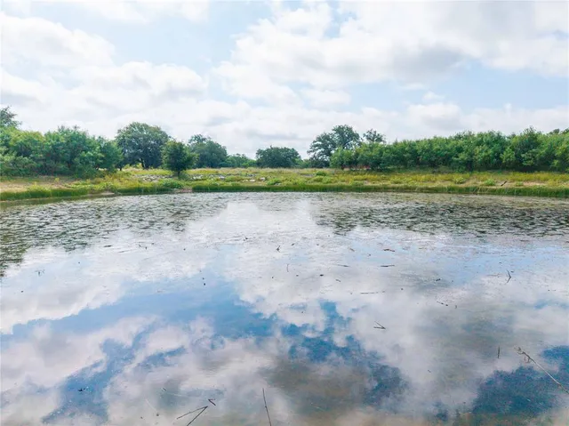 a view of a lake with a yard