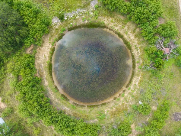 a view of a table and chairs in the garden