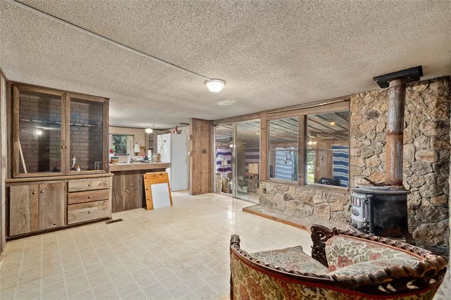 a large bathroom with a granite countertop tub sink and mirror