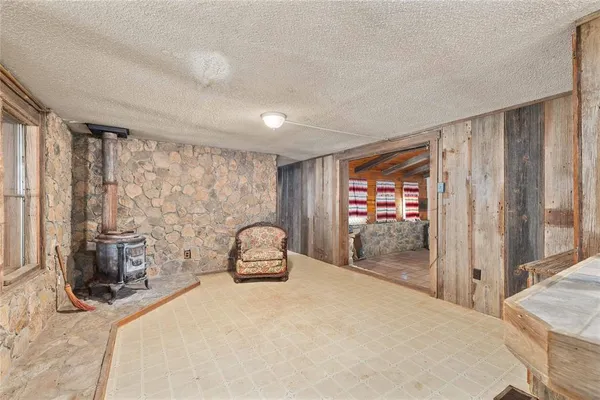 a bedroom with a large bed and a large window