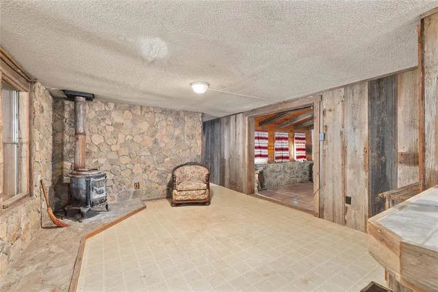 a bedroom with a large bed and a large window