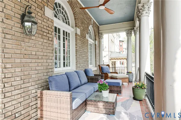 a view of a balcony with furniture