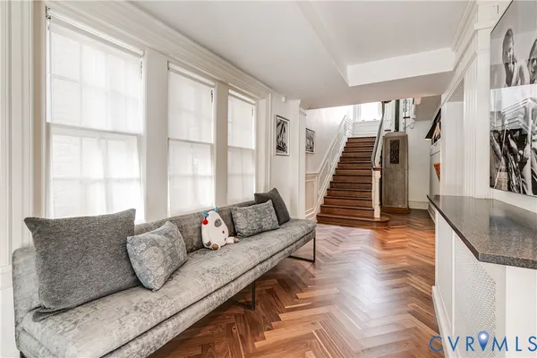 a living room with furniture and a large window