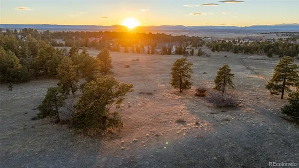 a view of a town with mountains in the background