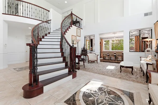 a view of entryway livingroom and hall with wooden floor