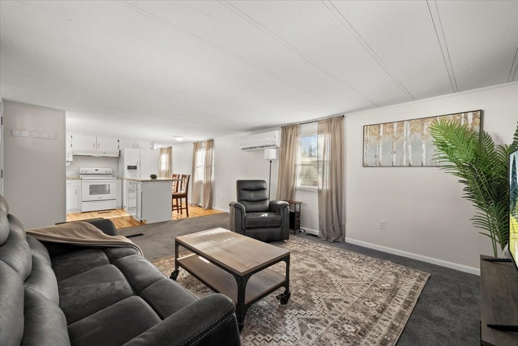 199 Windswept Road Wareham, MA 02571 - Photo 13 of 30 a living room with furniture and a rug