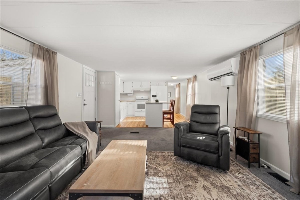 199 Windswept Road Wareham, MA 02571 - Photo 15 of 30 a living room with furniture and a flat screen tv