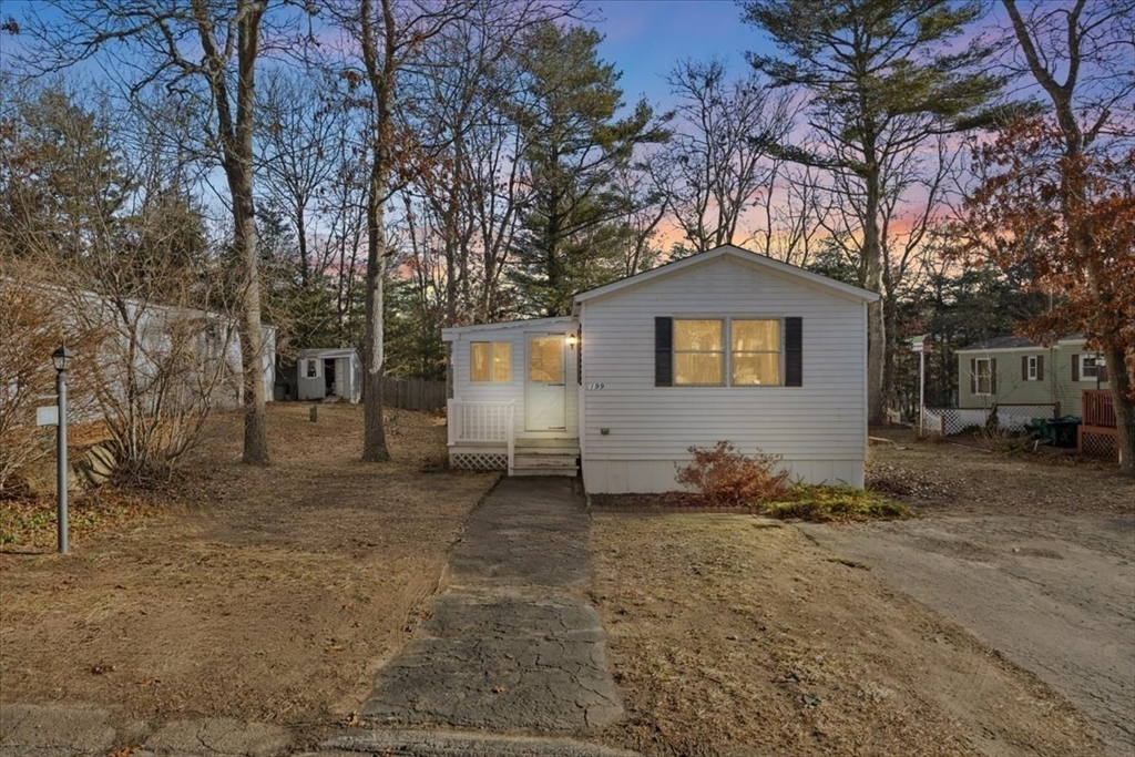199 Windswept Road Wareham, MA 02571 - Photo 2 of 30 a front view of a house with a yard