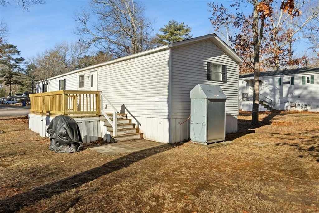 199 Windswept Road Wareham, MA 02571 - Photo 4 of 30 a view of a house with a patio