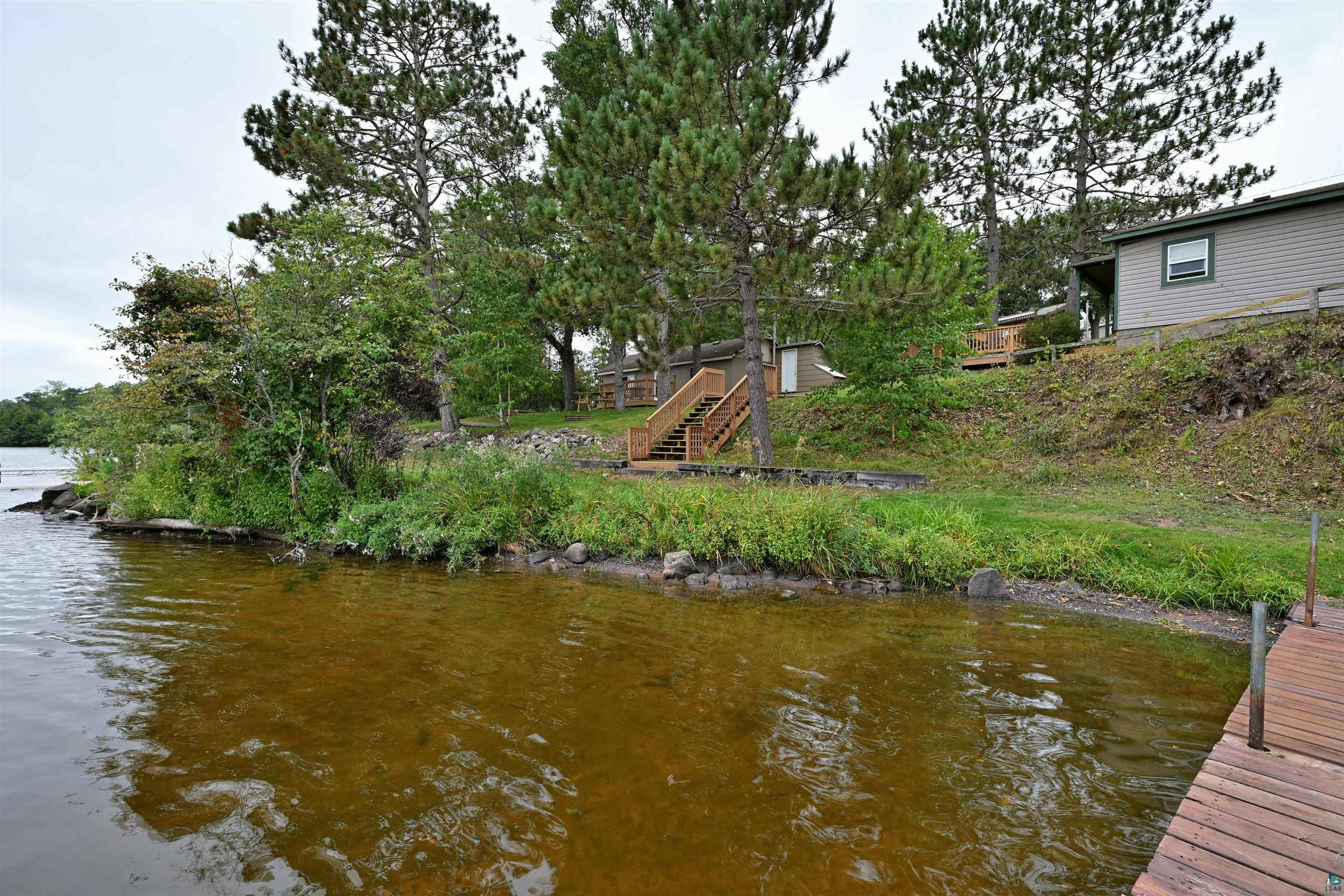 6833 View Point Lodge Road, Unit 14 Gordon, WI 54838 - Photo 4 of 34 Dock with a water view and stairway