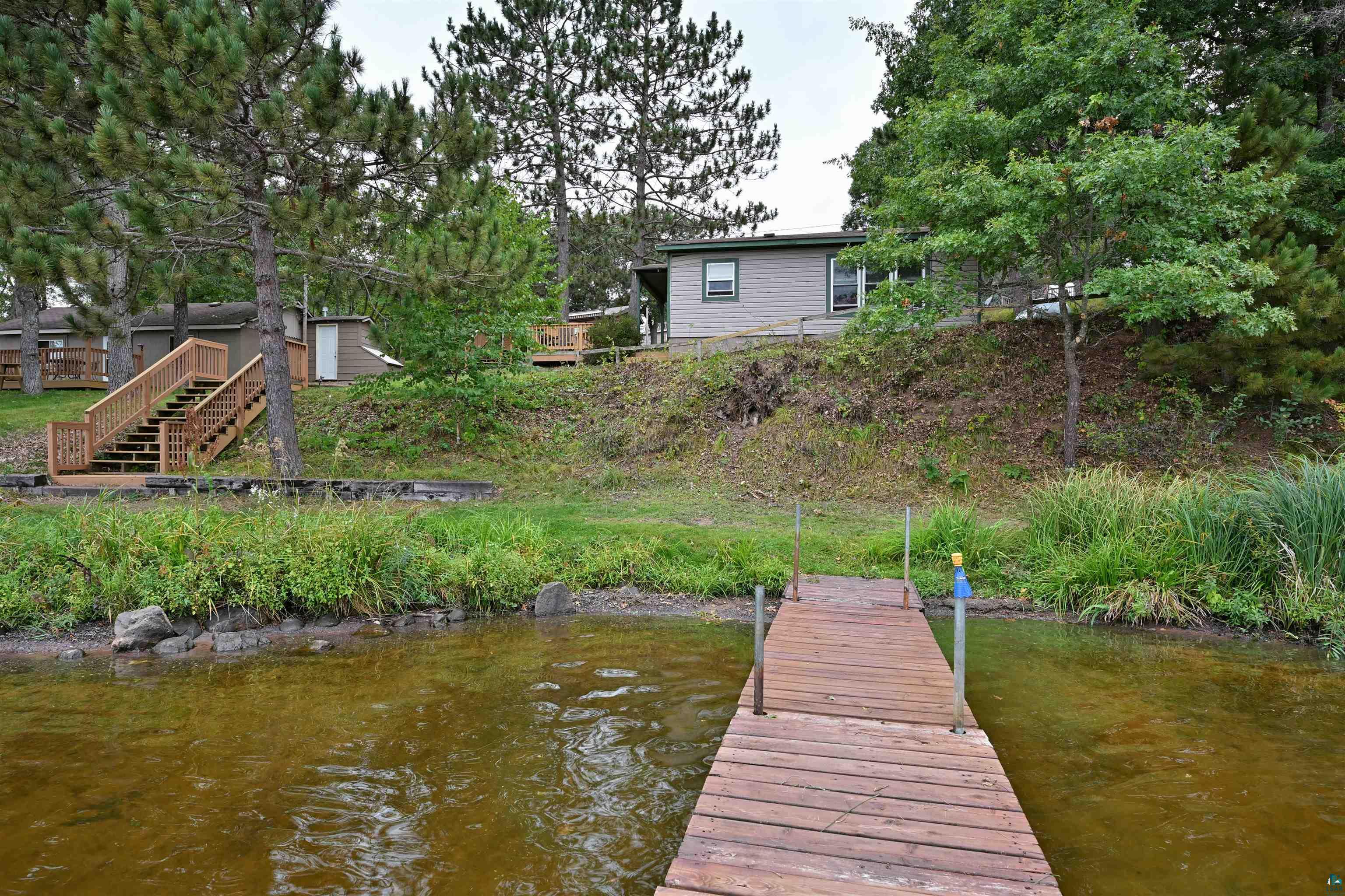 6833 View Point Lodge Road, Unit 14 Gordon, WI 54838 - Photo 8 of 34 Dock with a water view and stairway