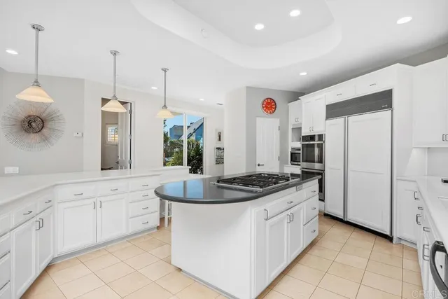 a kitchen with stove and cabinets