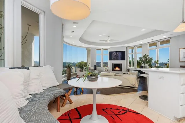 a living room with furniture fireplace and flat screen tv