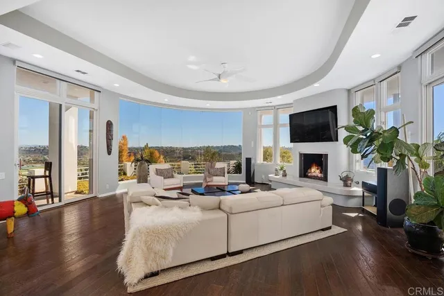 a living room with furniture fireplace and window