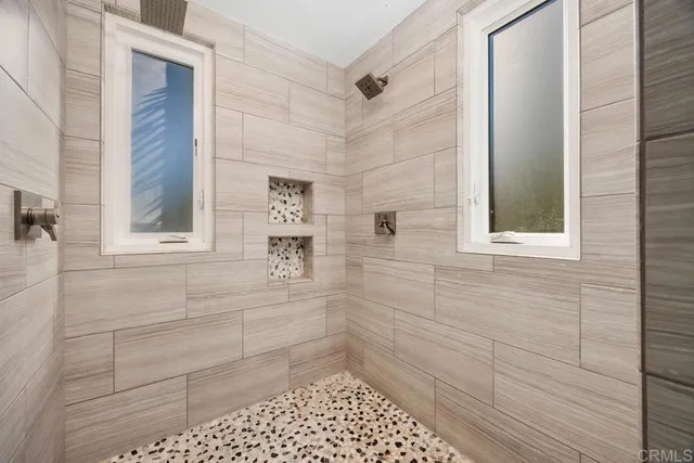 a view of a livingroom with workspace and a window