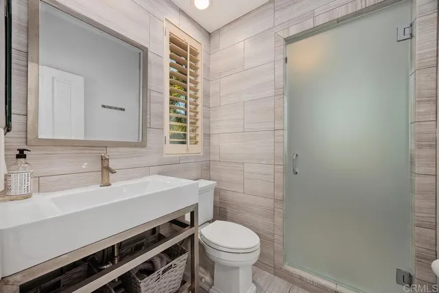 a living room with furniture and a piano