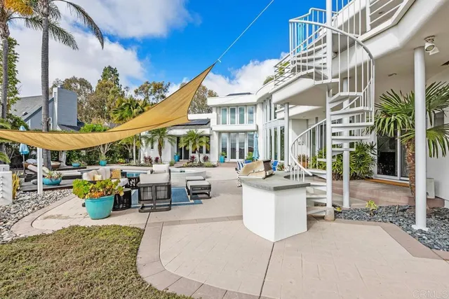a view of a swimming pool with a house in the background