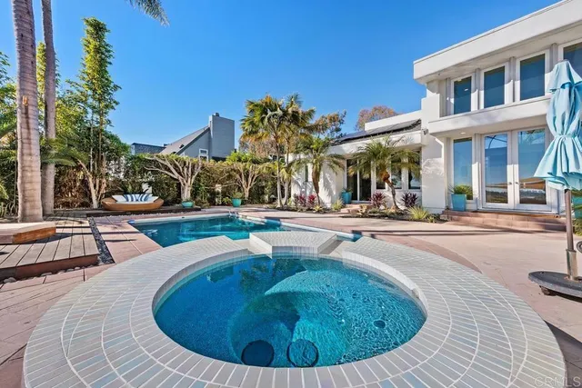 a view of a swimming pool with a patio