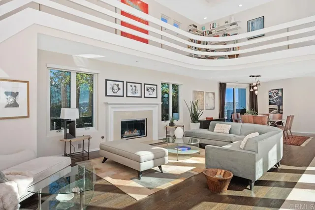 a living room with furniture or couch and a large window