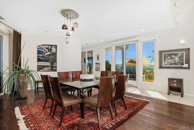 a large kitchen with kitchen island a large counter top space a sink stainless steel appliances and cabinets