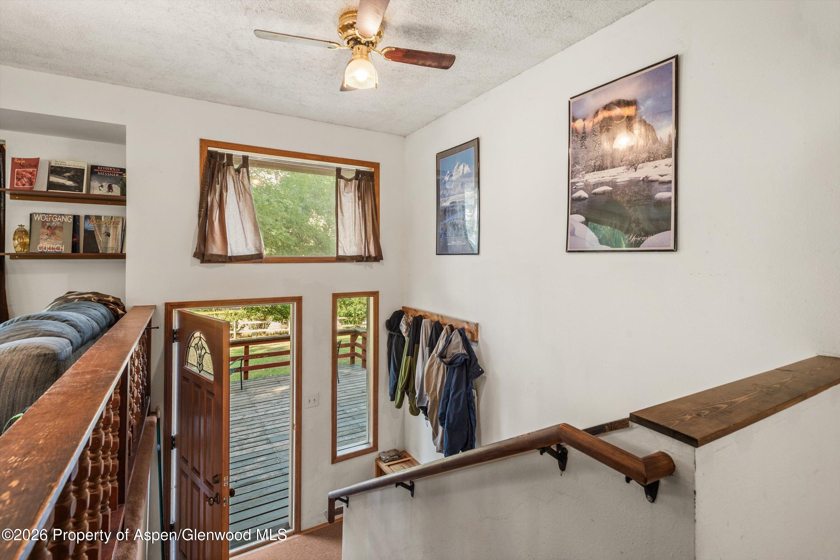 198 Holland Hills Road Basalt, CO 81621 - Photo 11 of 50 a view of a livingroom with furniture and ceiling fan