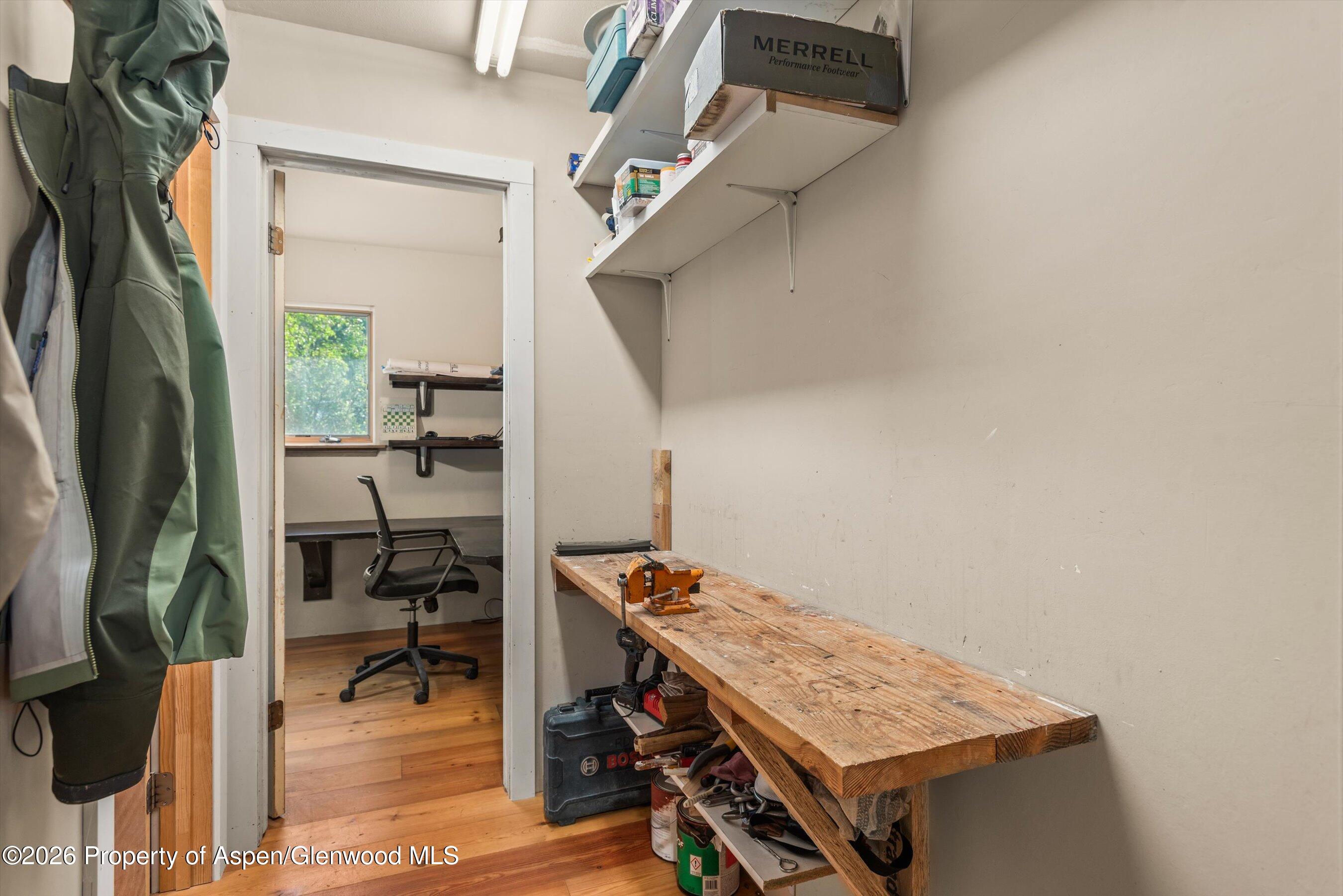198 Holland Hills Road Basalt, CO 81621 - Photo 26 of 50 a view of workspace with wooden floor and furniture