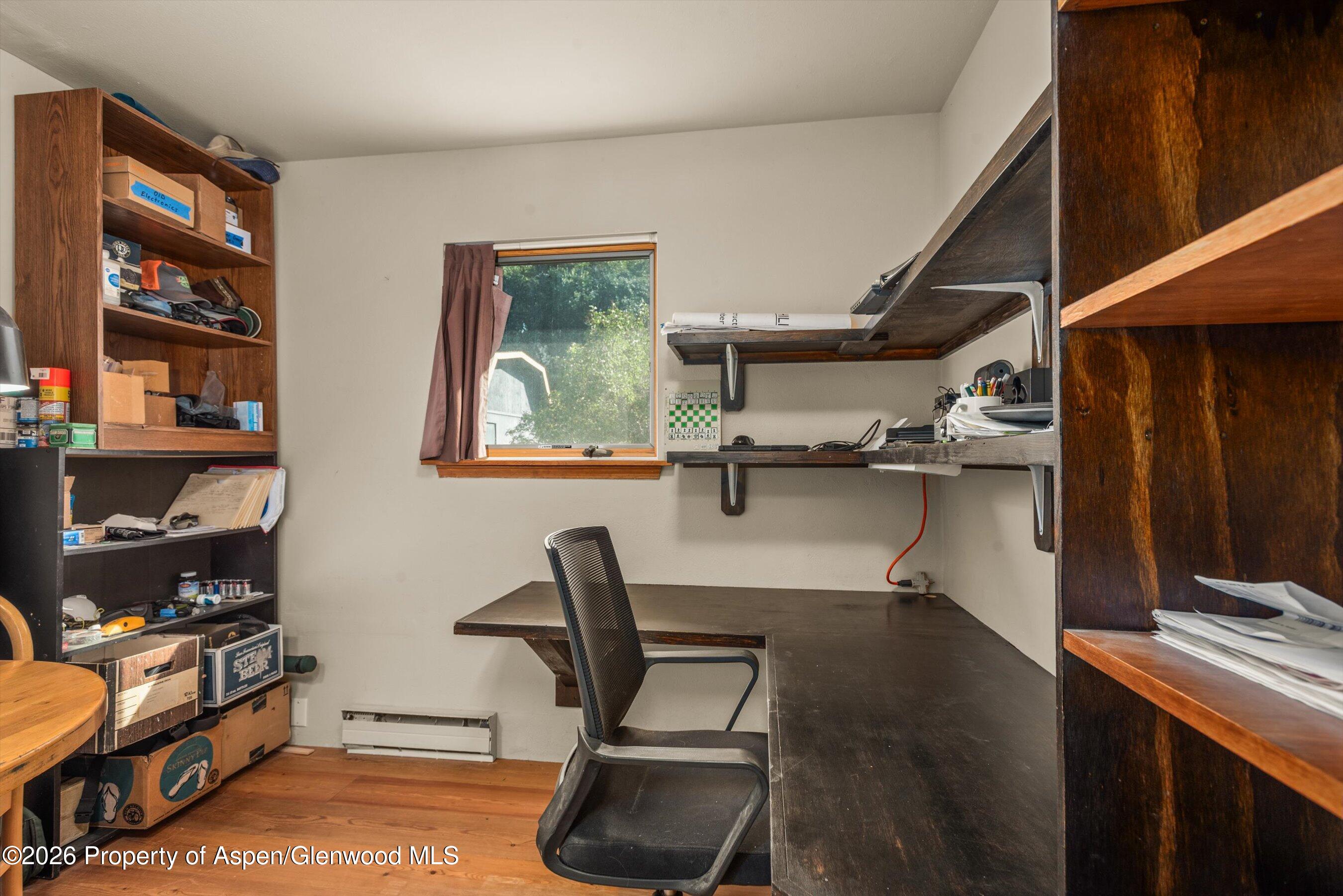 198 Holland Hills Road Basalt, CO 81621 - Photo 27 of 50 a work room with furniture and wooden floor