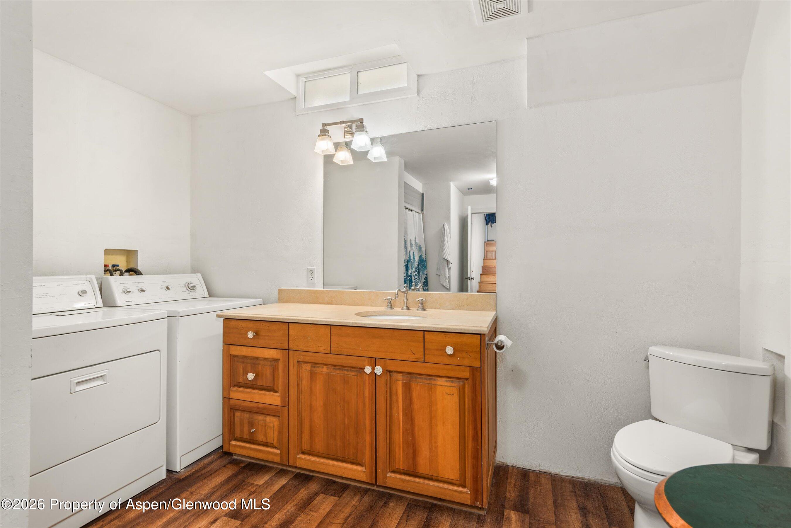 198 Holland Hills Road Basalt, CO 81621 - Photo 29 of 50 a spacious bathroom with a granite countertop toilet sink and mirror