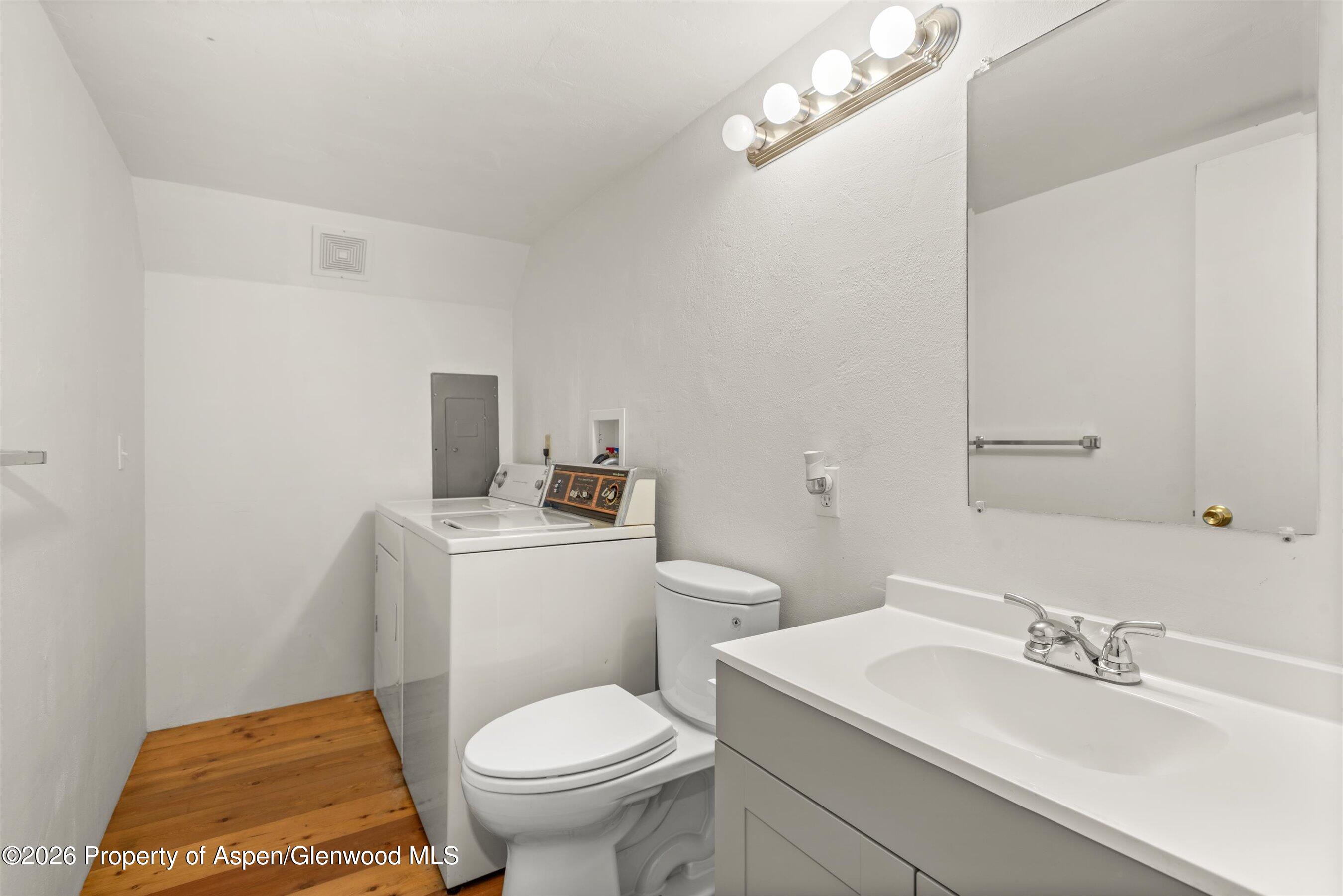 198 Holland Hills Road Basalt, CO 81621 - Photo 37 of 50 a bathroom with a sink a toilet and mirror