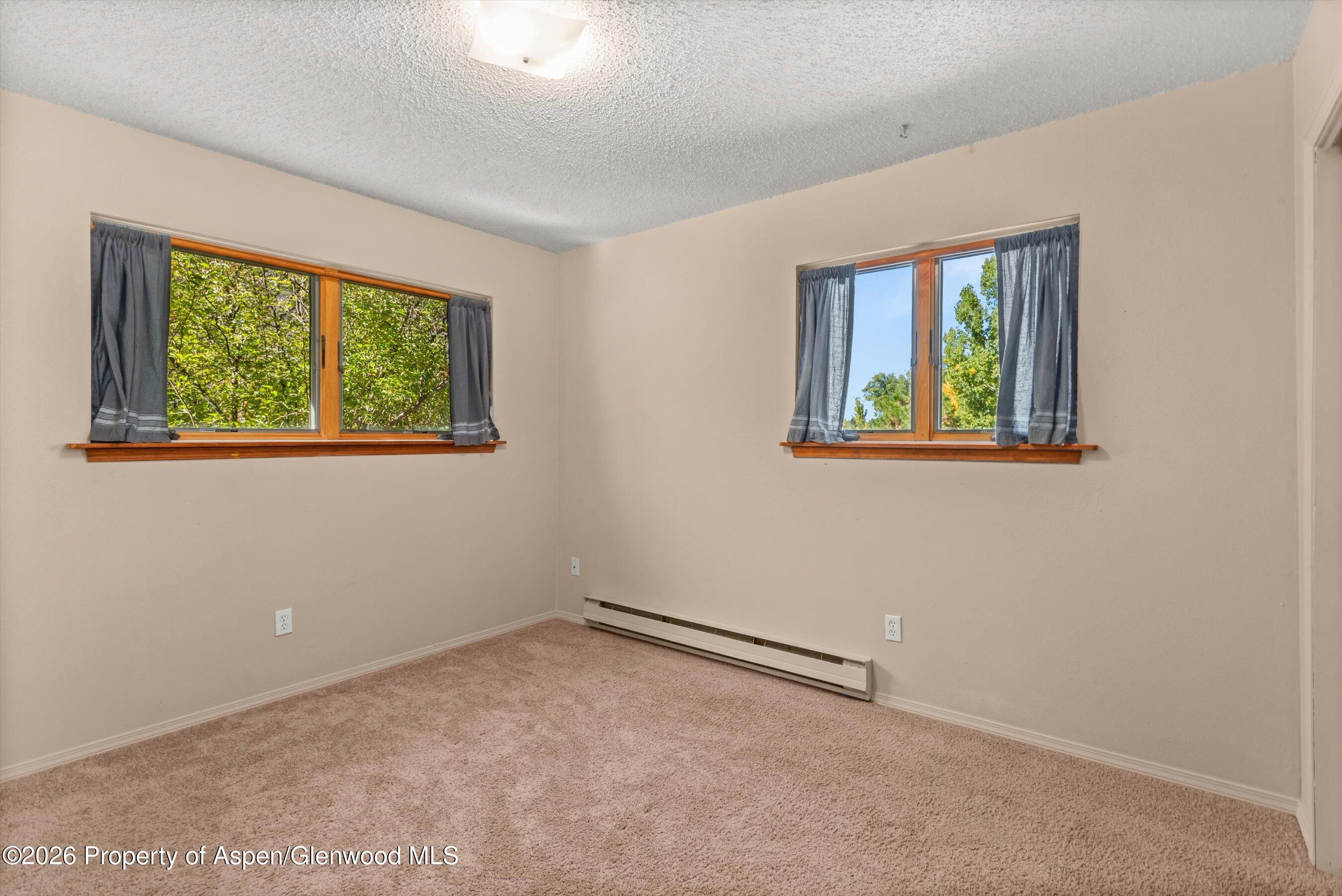 198 Holland Hills Road Basalt, CO 81621 - Photo 39 of 50 an empty room with windows