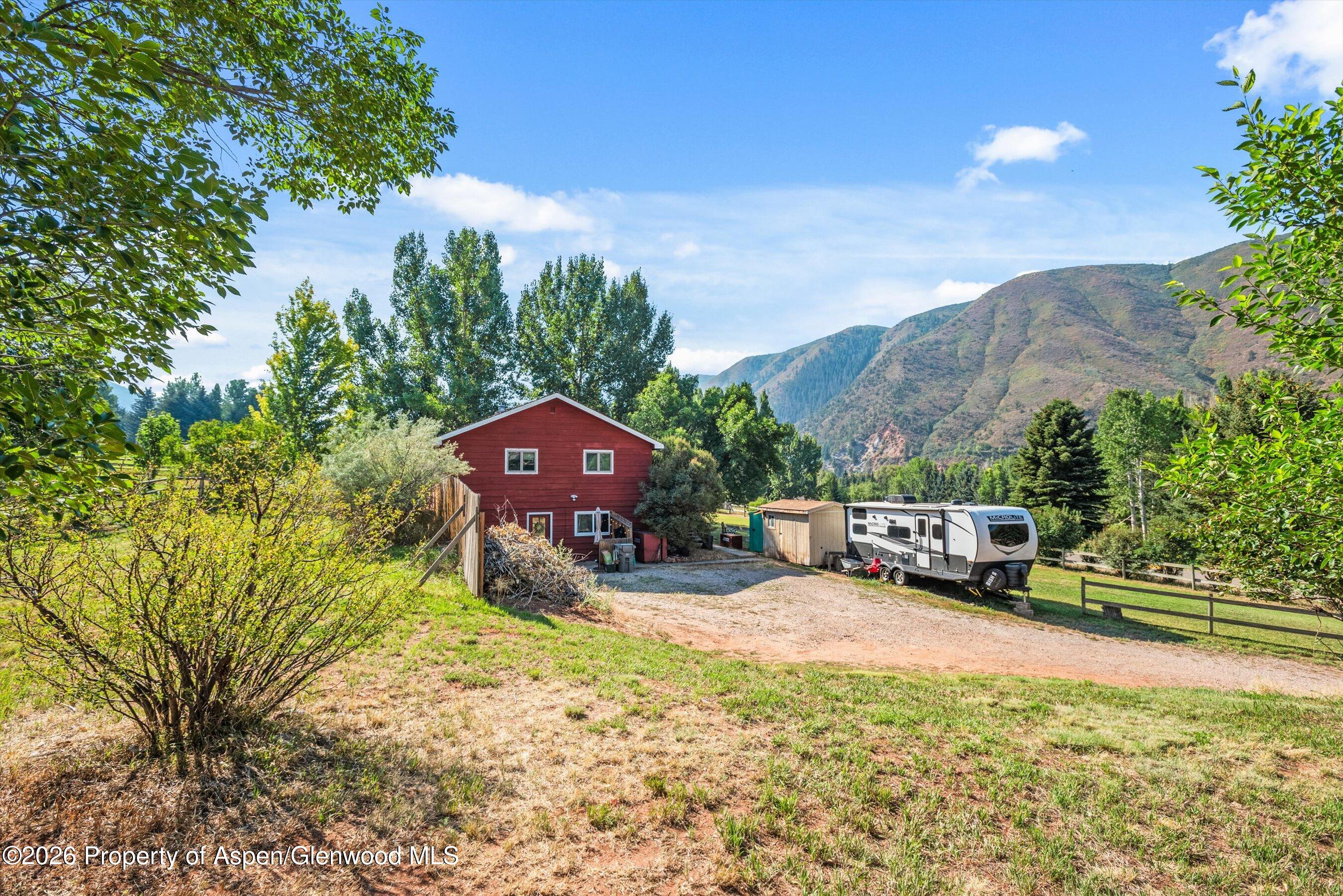198 Holland Hills Road Basalt, CO 81621 - Photo 42 of 50 a view of a house with a yard and sitting area