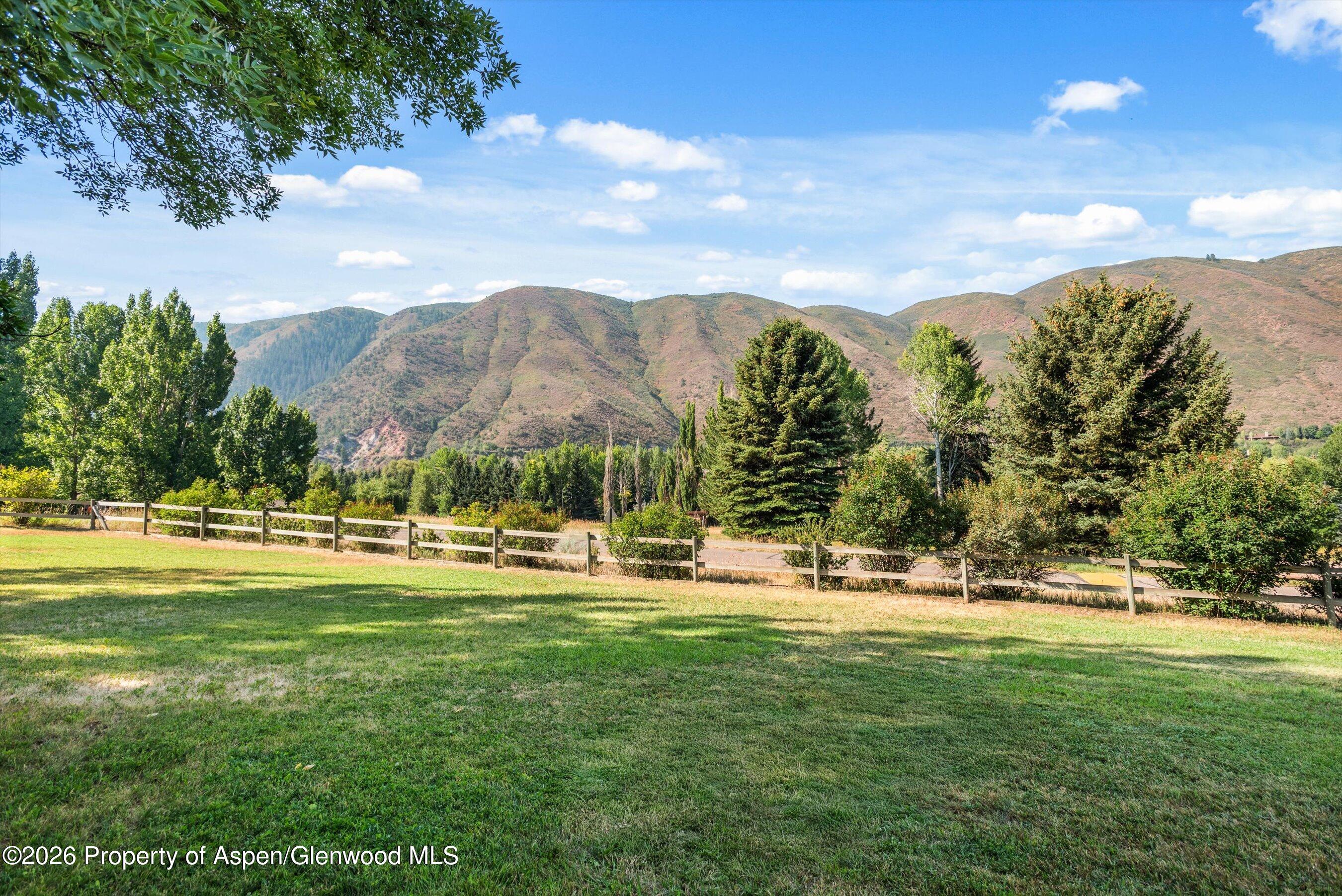 198 Holland Hills Road Basalt, CO 81621 - Photo 44 of 50 a view of a town with mountains in the background