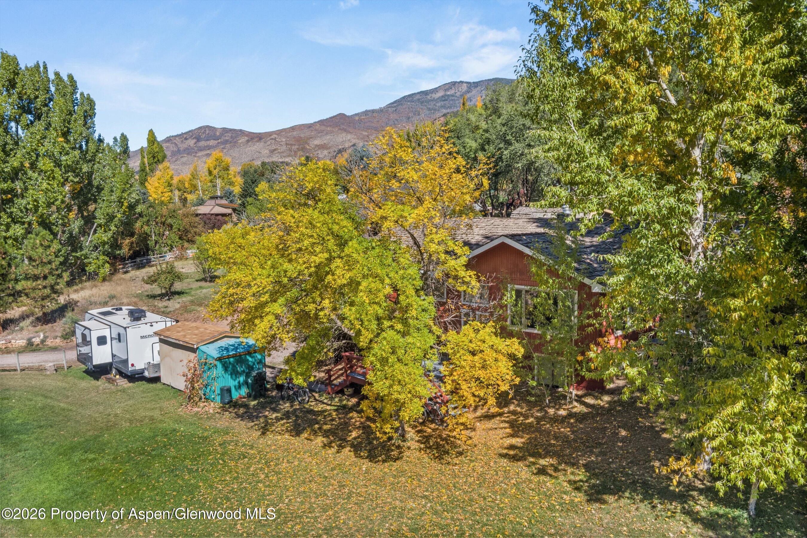 198 Holland Hills Road Basalt, CO 81621 - Photo 46 of 50 a view of a house with a yard