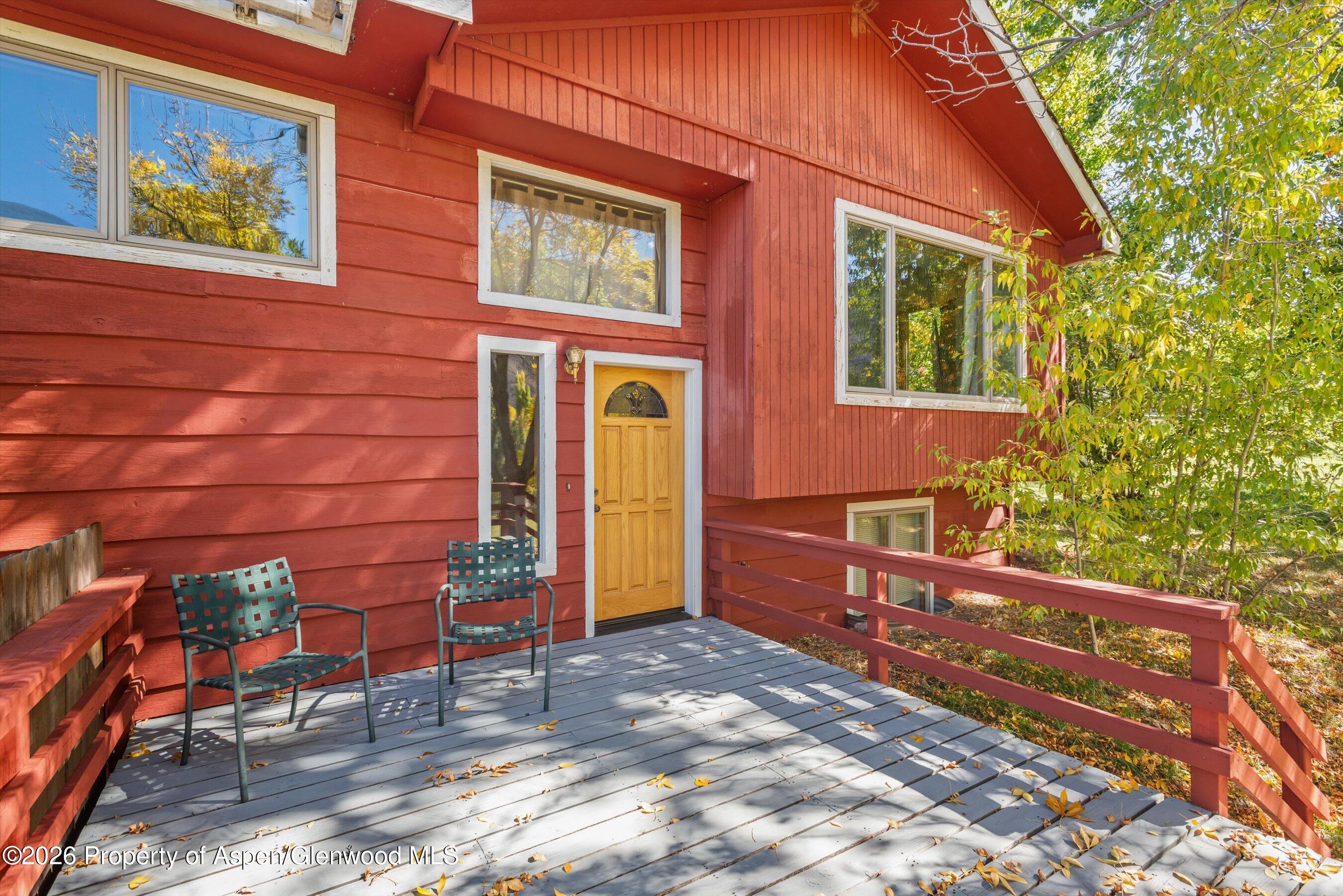 198 Holland Hills Road Basalt, CO 81621 - Photo 10 of 50 a backyard of a house with barbeque oven