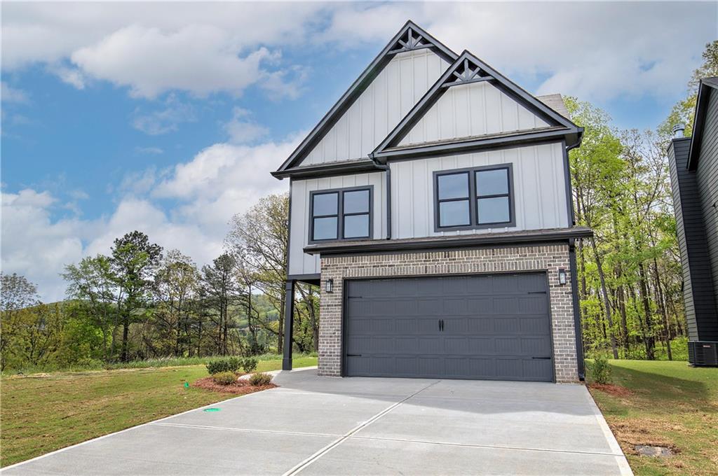 266 Summit Height Drive Cartersville, GA 30121 - Photo 1 of 51 a front view of a house with a garden