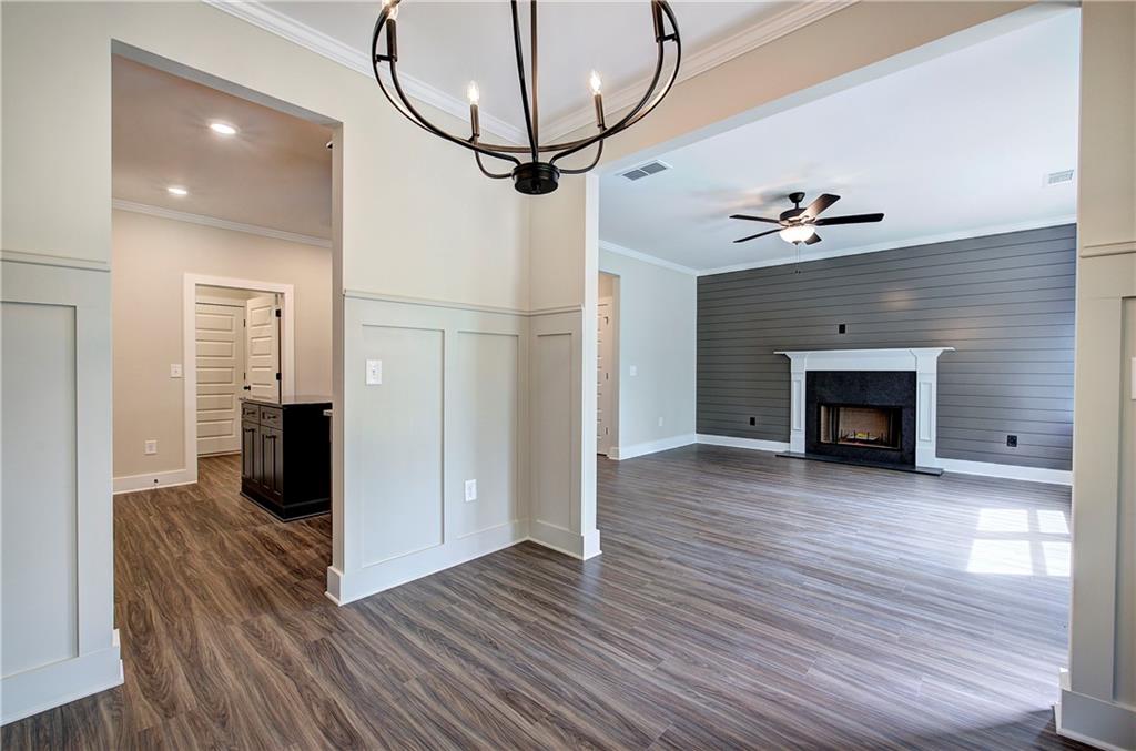 266 Summit Height Drive Cartersville, GA 30121 - Photo 14 of 51 a view of a livingroom with wooden floor and a fireplace