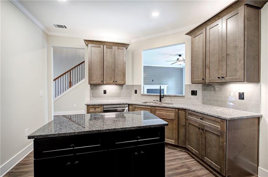 266 Summit Height Drive Cartersville, GA 30121 - Photo 18 of 51 a kitchen with stainless steel appliances granite countertop a sink stove and cabinets