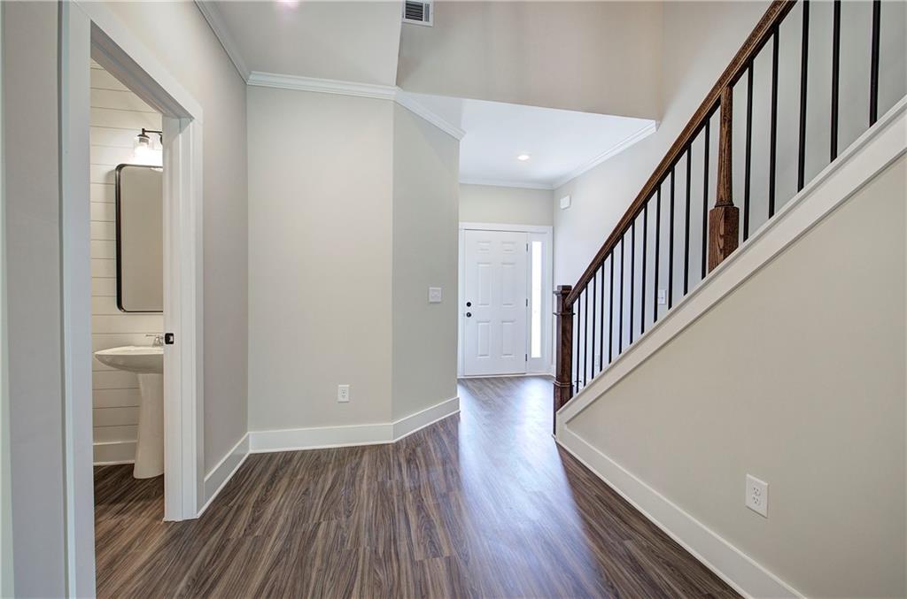 266 Summit Height Drive Cartersville, GA 30121 - Photo 22 of 51 a view of a hallway with wooden floor and staircase