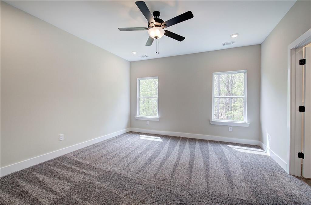 266 Summit Height Drive Cartersville, GA 30121 - Photo 28 of 51 a view of an empty room with a window and wooden floor