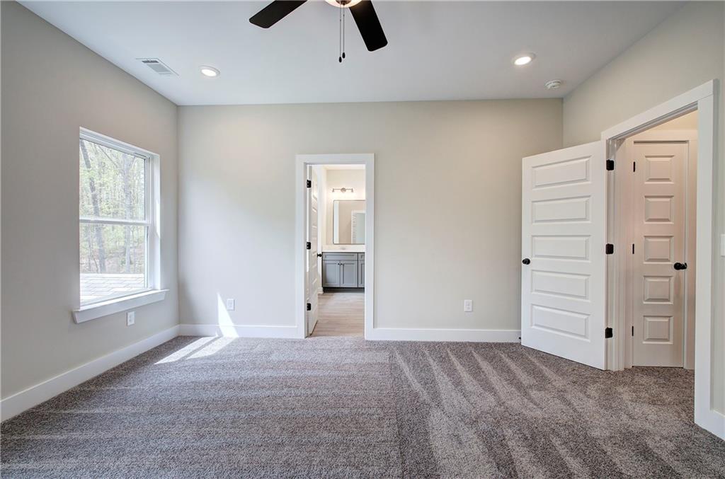 266 Summit Height Drive Cartersville, GA 30121 - Photo 29 of 51 an empty room with closet and windows