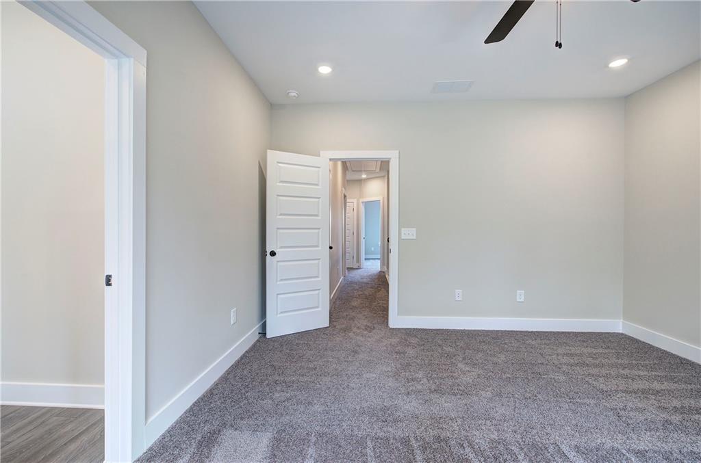266 Summit Height Drive Cartersville, GA 30121 - Photo 31 of 51 an empty room with closet and a chandelier fan