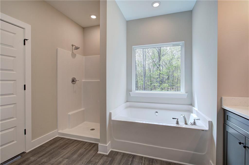266 Summit Height Drive Cartersville, GA 30121 - Photo 33 of 51 a bathroom with a bathtub and a shower