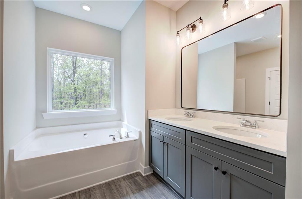 266 Summit Height Drive Cartersville, GA 30121 - Photo 34 of 51 a bathroom with a bathtub and a sink