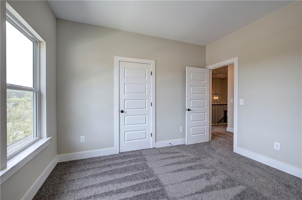266 Summit Height Drive Cartersville, GA 30121 - Photo 42 of 51 an empty room with windows and closet