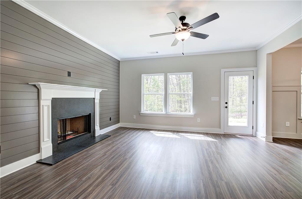266 Summit Height Drive Cartersville, GA 30121 - Photo 8 of 51 wooden floor fireplace and windows in an empty room