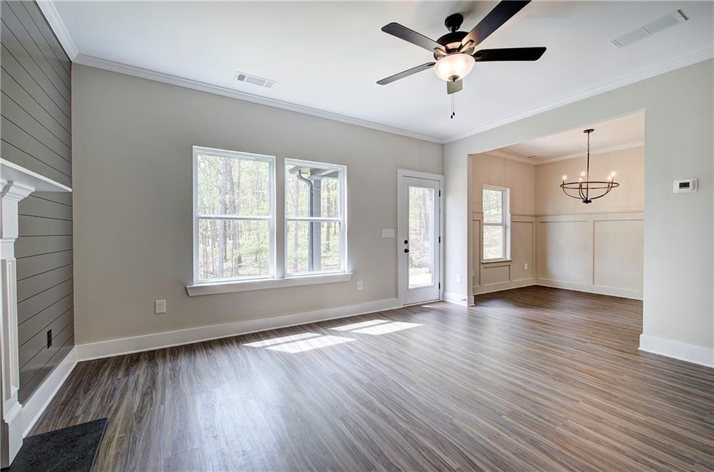 266 Summit Height Drive Cartersville, GA 30121 - Photo 9 of 51 a view of an empty room with window and wooden floor