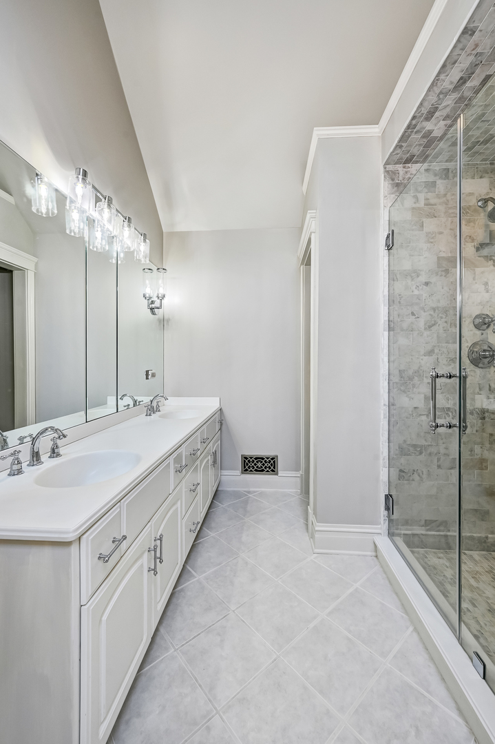 540 Ridgemoor Drive Willowbrook, IL 60527 - Photo 25 of 62 a spacious bathroom with a double vanity sink mirror and shower