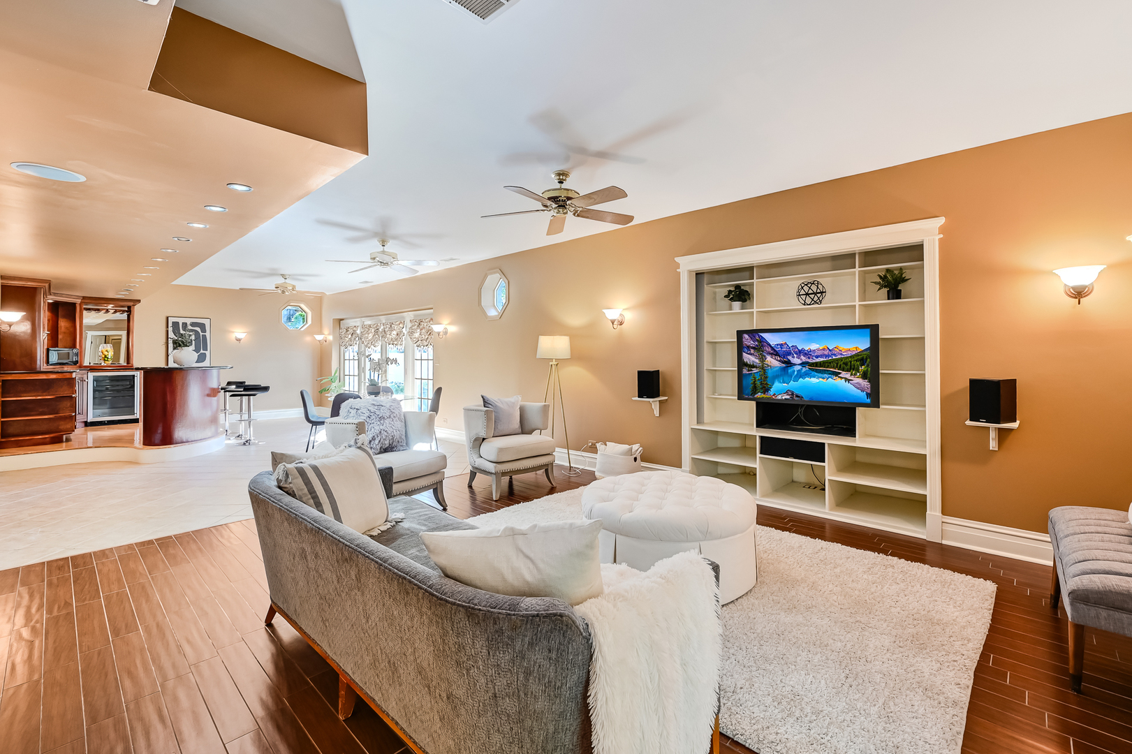 540 Ridgemoor Drive Willowbrook, IL 60527 - Photo 28 of 62 a living room with furniture a flat screen tv and kitchen view