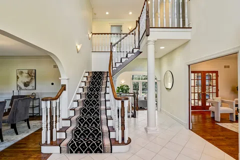a view of entryway with livingroom and window